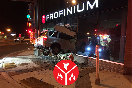 Disaster restoration team cleaning up after a car ran into the Profinium building